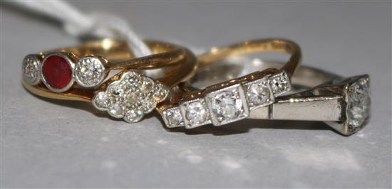 Four assorted gold and diamond rings